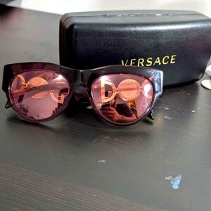 Almost brand new., two pairs of Versace sunglasses.